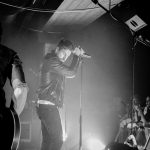 man standing in front of people