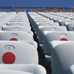 white plastic chairs on a sunny day