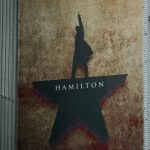 The "hamilton" musical logo is displayed on a building.