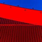 A close-up of one of my favorite eye-catching pieces of architecture in LA the Petersen Automotive Museum. The natural color of the curvy structure is silver, but the building’s night lighting transforms its bottom part to red, while the dusk sky paints the front side of the structure with navy blue.